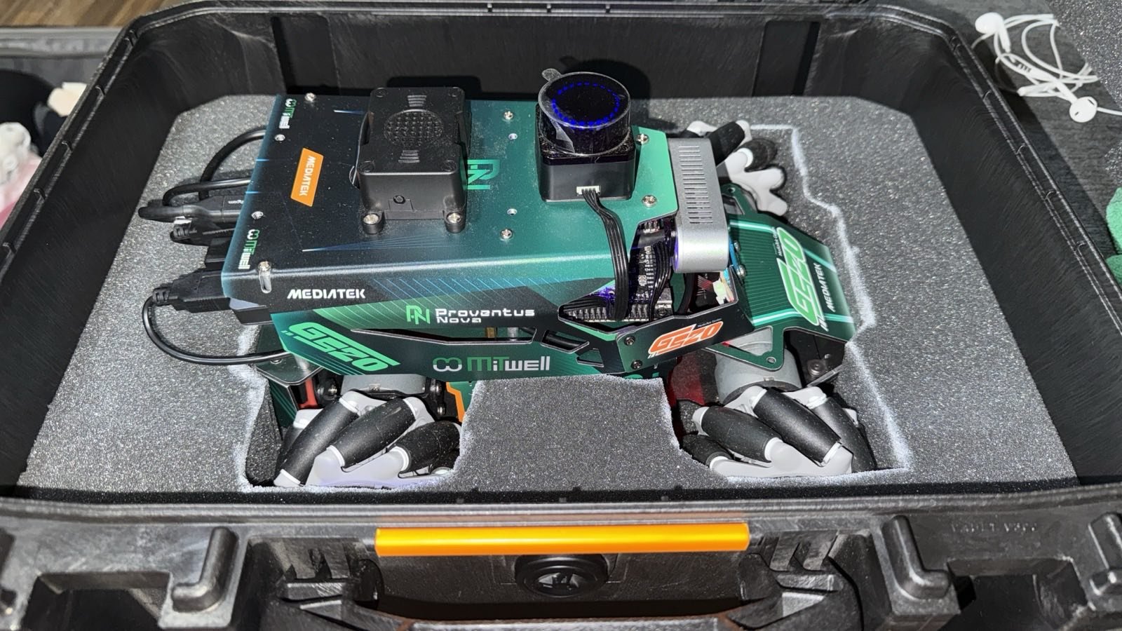 Close-up of the ROSOrin robot showing the LD06 lidar dome on top, integrated with the MediaTek Genio over USB