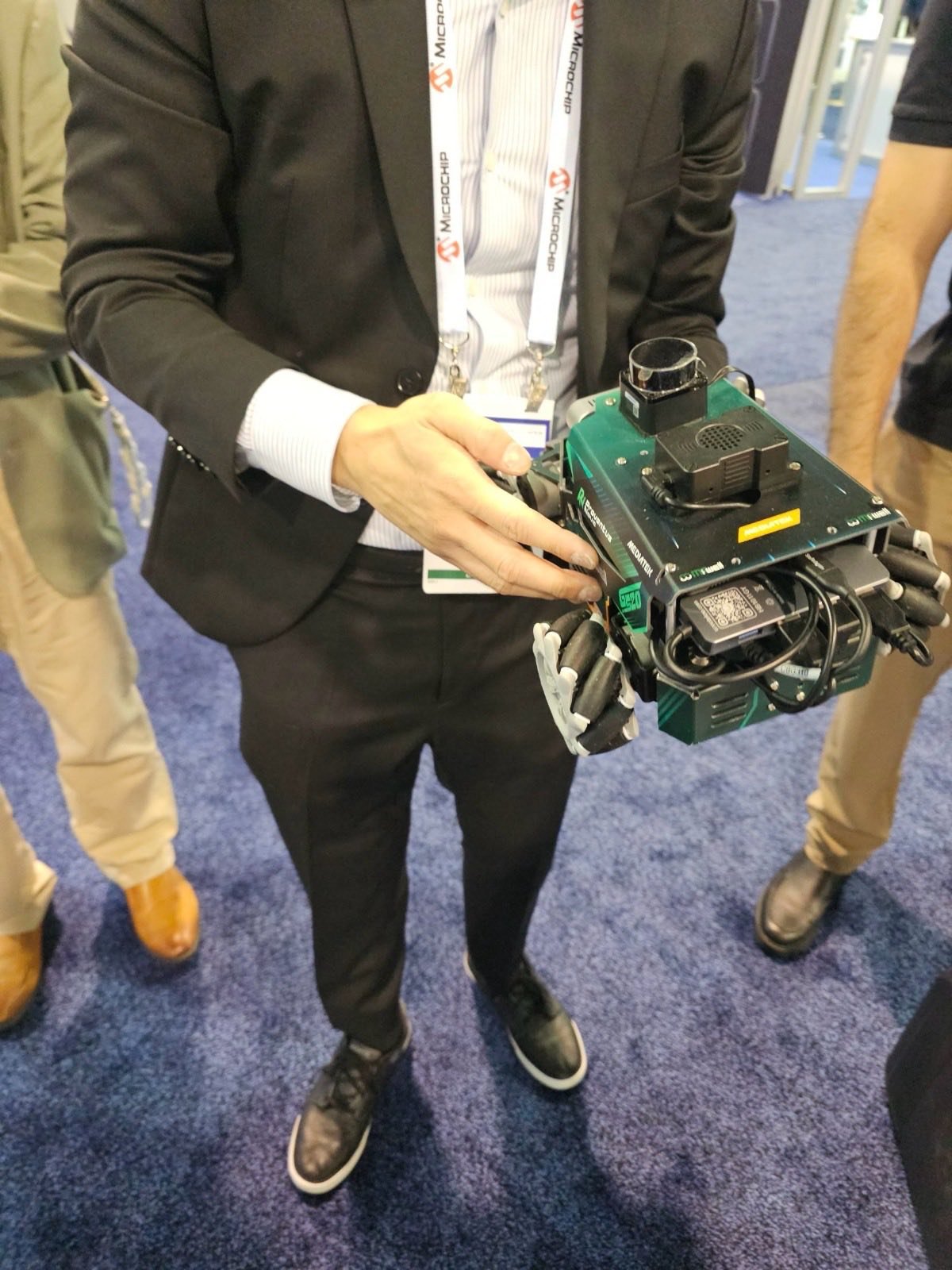 The ROSOrin robot showing its mecanum wheels with angled rollers, driven from ROS 2 on the MediaTek Genio